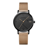 A Swinger Swiss Made analog watch with a black round dial, minimalist gold-tone hands and markers, and a rose gold-tone mesh metal strap, shown against a plain white background.