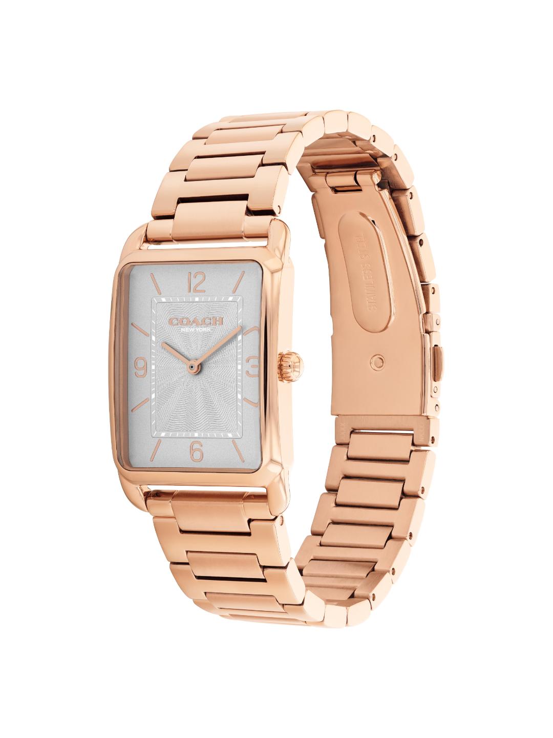 A Coach women's watch featuring a rectangular rose gold-tone metal case and a matching metal link bracelet, with a silver dial and rose gold-tone numerals.