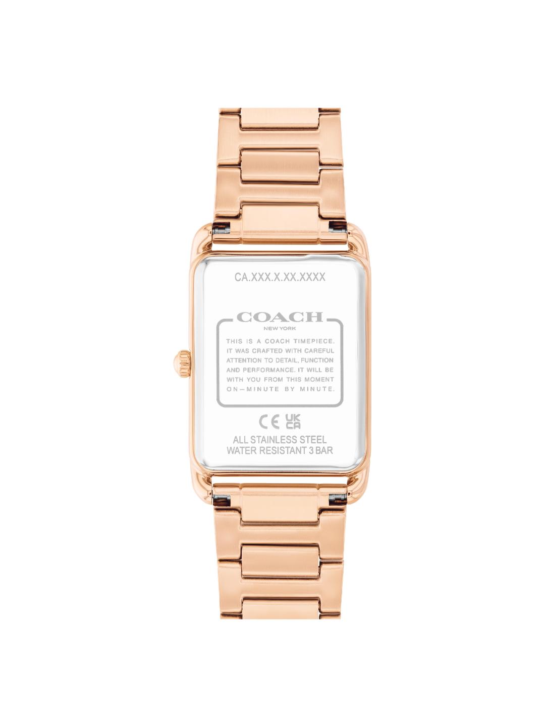 The back view of a Coach women's stainless steel watch with a rose gold-tone metal case and link bracelet, featuring a white backplate with technical specifications.