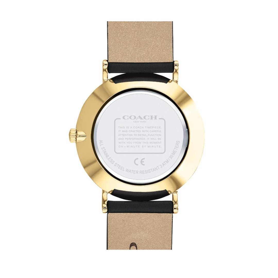 The back view of a Coach wristwatch with a gold-tone case and a beige leather strap with black accents, on a plain white background.