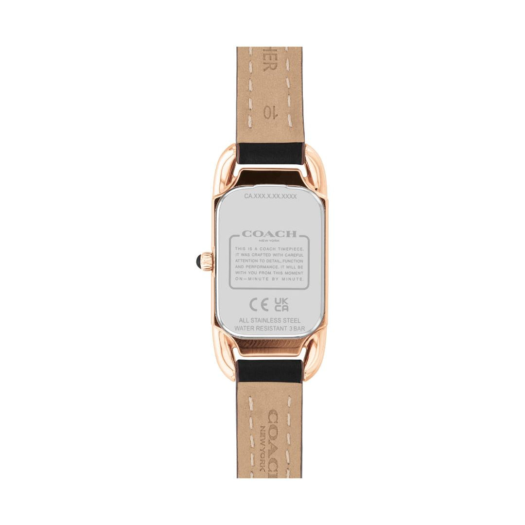 The back view of a Coach women's watch featuring a rose gold case and a light tan leather strap with black stitching.