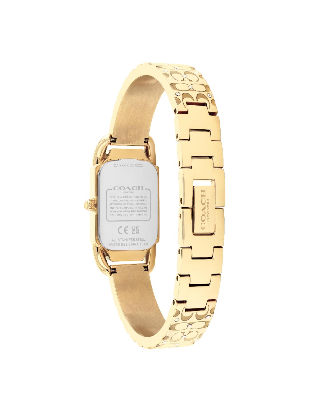 Gold-tone Coach women's watch shown from the back, featuring a rectangular case with a silver-toned backplate and a link bracelet with a repeating Coach logo pattern.