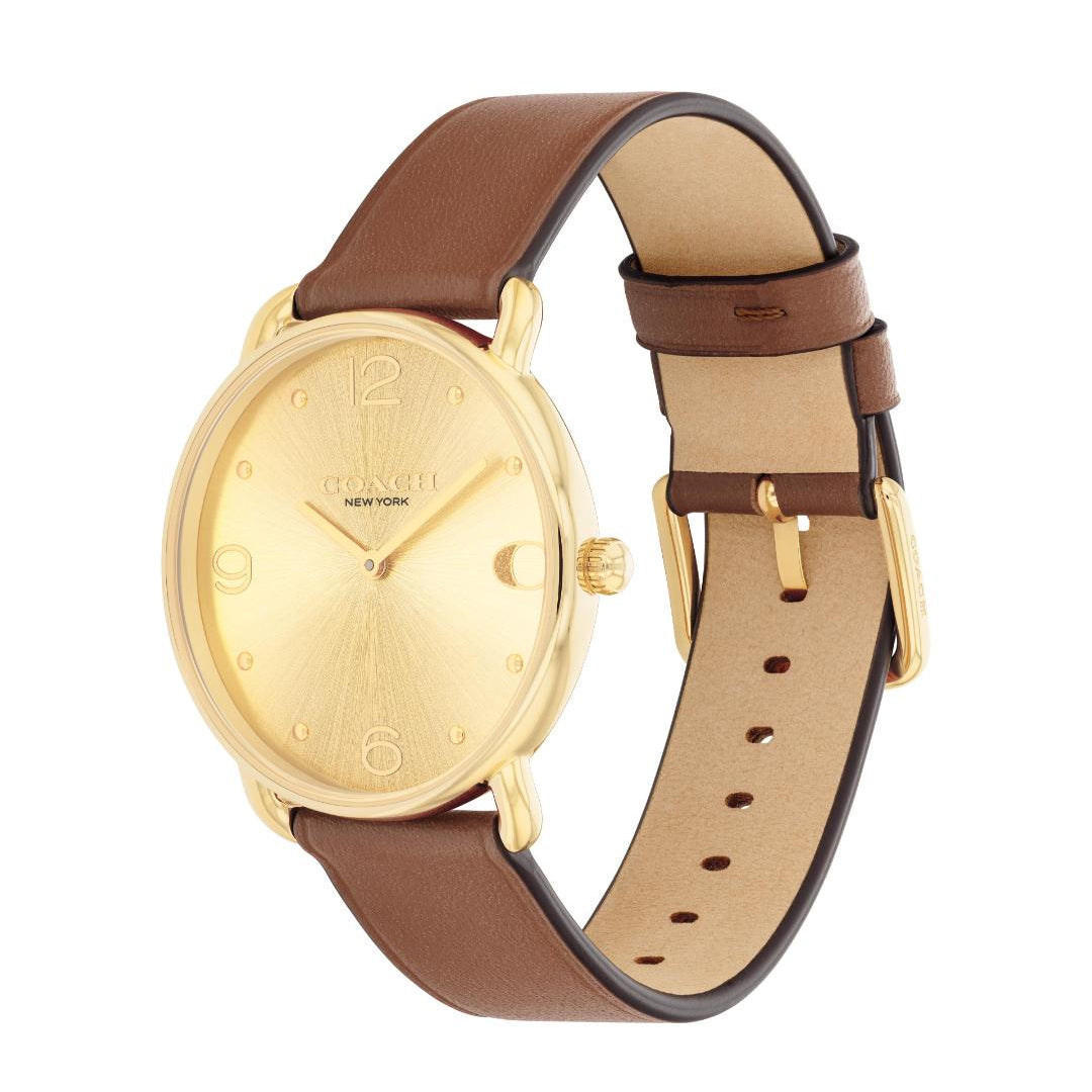 A Tohato New York analog watch with a gold-tone round dial, gold-tone case, and a brown leather strap with a tan interior, shown on a plain white background.