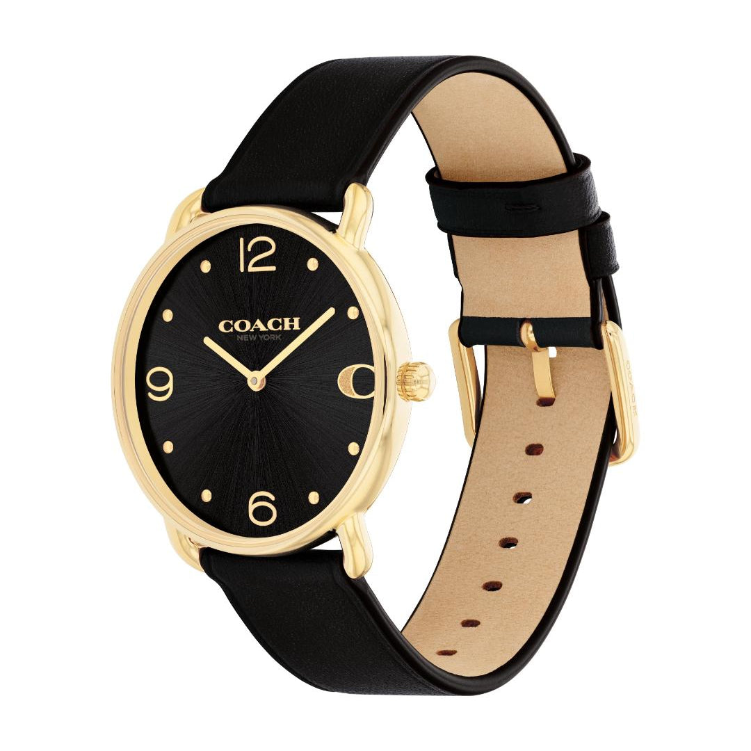 A Coach women's watch featuring a black dial, gold-tone case, and a black leather strap with a beige interior lining and gold buckle.