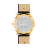 The back view of a Coach wristwatch with a gold-tone case and a black leather strap, showing the silver-toned backplate and brand name.