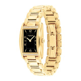 A Coach women's watch featuring a gold-tone rectangular case with a black dial, diamond accents along the bezel, and a matching gold-tone link bracelet.