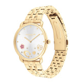 A gold-tone stainless steel watch with a white dial, featuring gold-tone hands, a small pink flower, and heart-shaped markers on a clean white background.