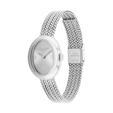 A silver-tone women's watch by Coach with a round silver dial and a textured mesh metal bracelet, shown on a plain white background.