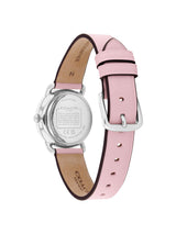 A Coach women's watch shown from the back, featuring a light pink leather strap with a silver buckle and a silver stainless steel case on a white background.