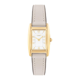 A women's rectangular analog watch with a gold-tone case, white dial with gold Arabic numerals, and a light beige leather strap, shown against a plain white background.