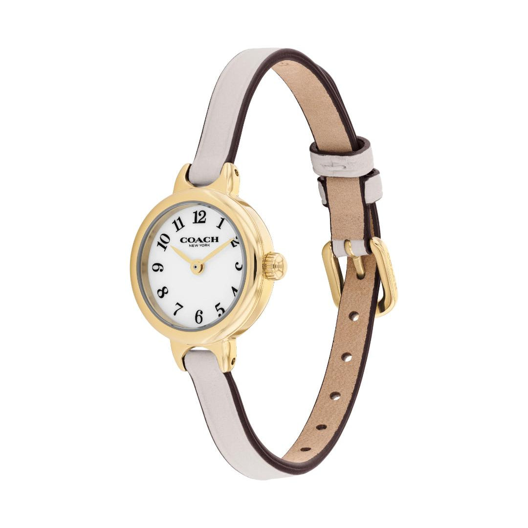 A Coach women's watch with a slim white leather strap, gold-tone case, and white dial with black Arabic numerals.