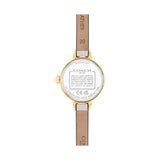 The back view of a Coach wristwatch with a gold-toned case, a white dial insert, and a light brown leather strap on a plain white background.