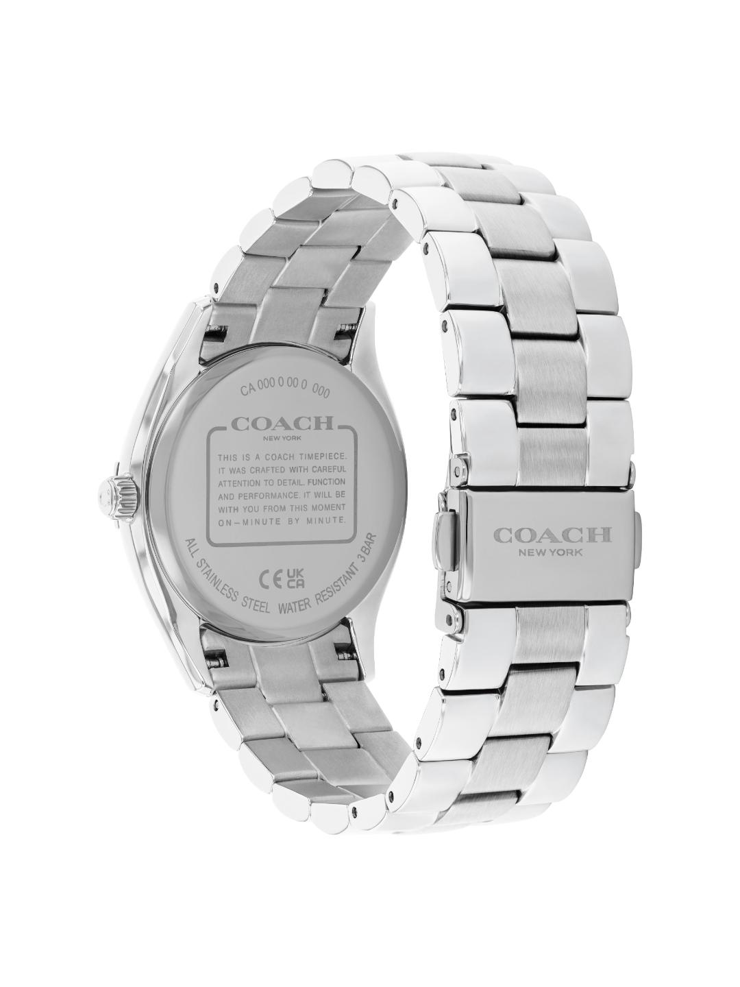 A silver stainless steel Coach wristwatch shown from the back, featuring a metal link bracelet and a brushed metal case with brand text engraved on the back.