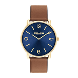 A Coach New York wristwatch with a blue sunburst dial, gold-tone case, and a brown leather strap, shown against a plain white background.