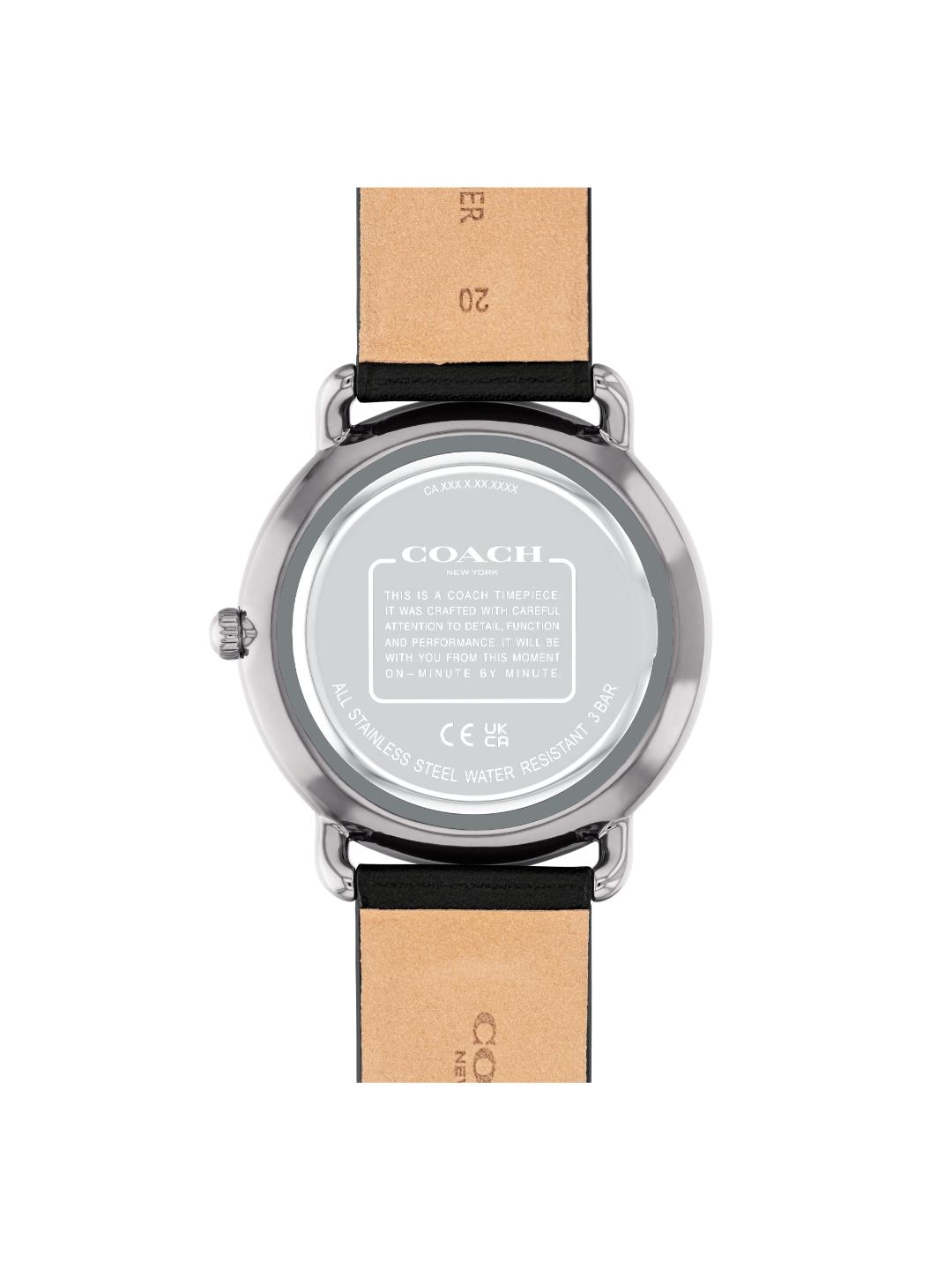 The back view of a Coach wristwatch with a round silver-tone stainless steel case and a light tan leather strap, shown on a plain white background.