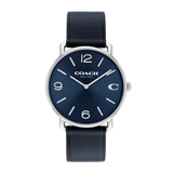 A Coach New York wristwatch with a dark blue sunburst dial, silver-tone case, and a dark blue leather strap, shown against a plain white background.