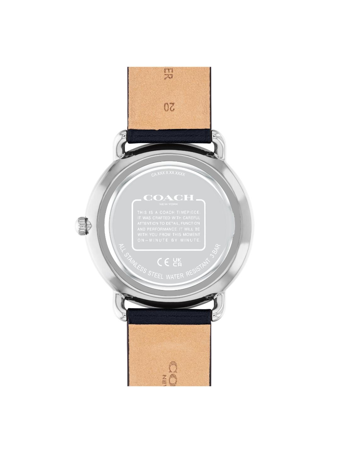 The back view of a Coach wristwatch with a silver stainless steel case and a light tan leather strap, shown on a plain white background.