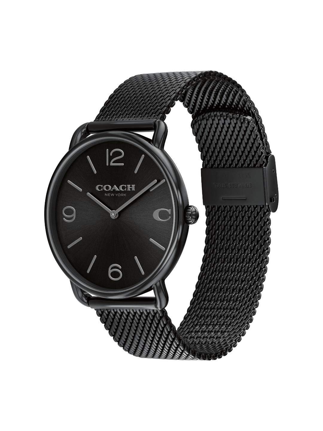 A Coach analog watch with a black round dial, black bezel, and a black mesh metal strap, shown on a plain white background.