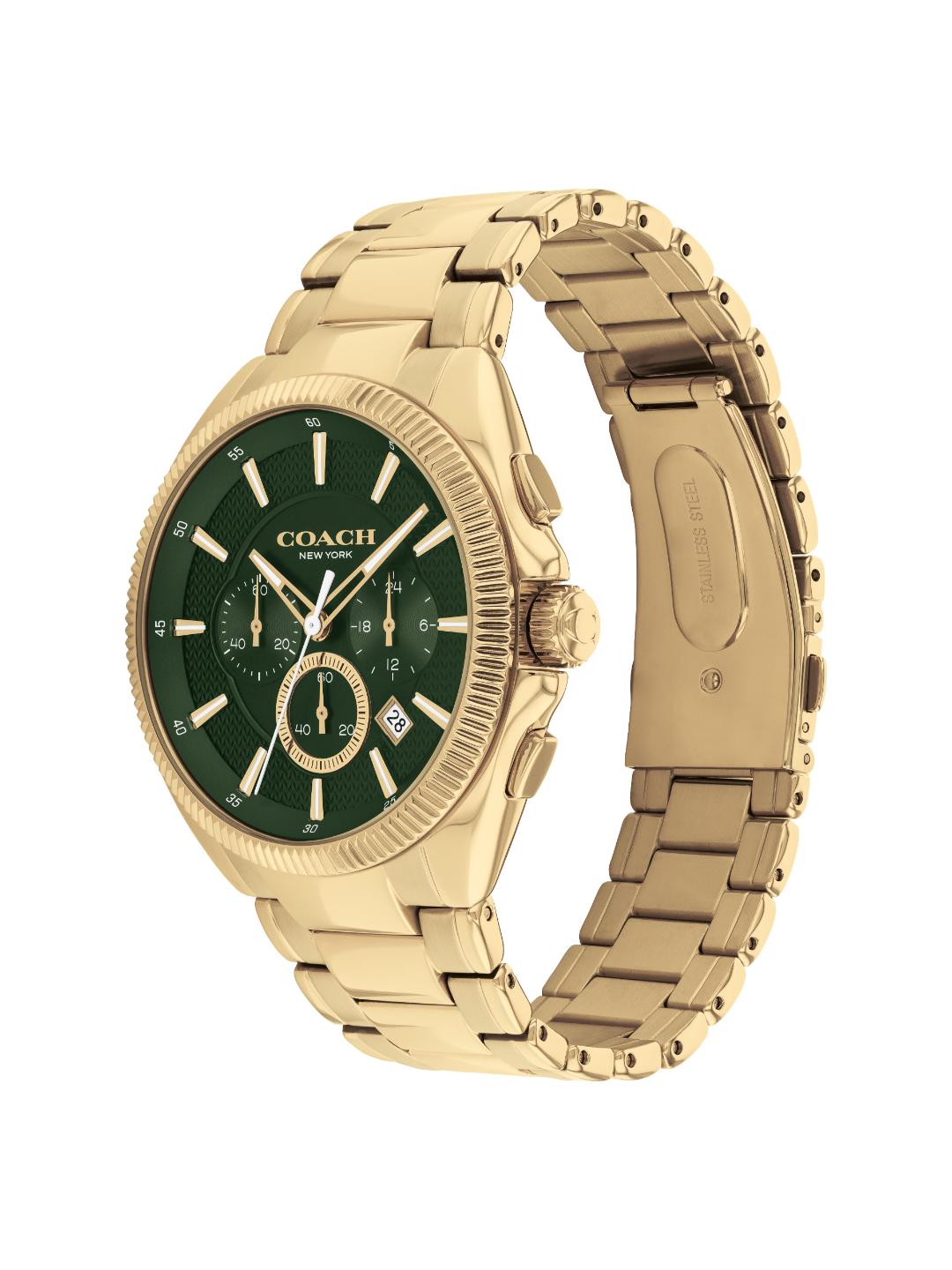 A Coach men's watch featuring a gold-tone metal case and link bracelet with a dark green dial, shown on a plain white background.