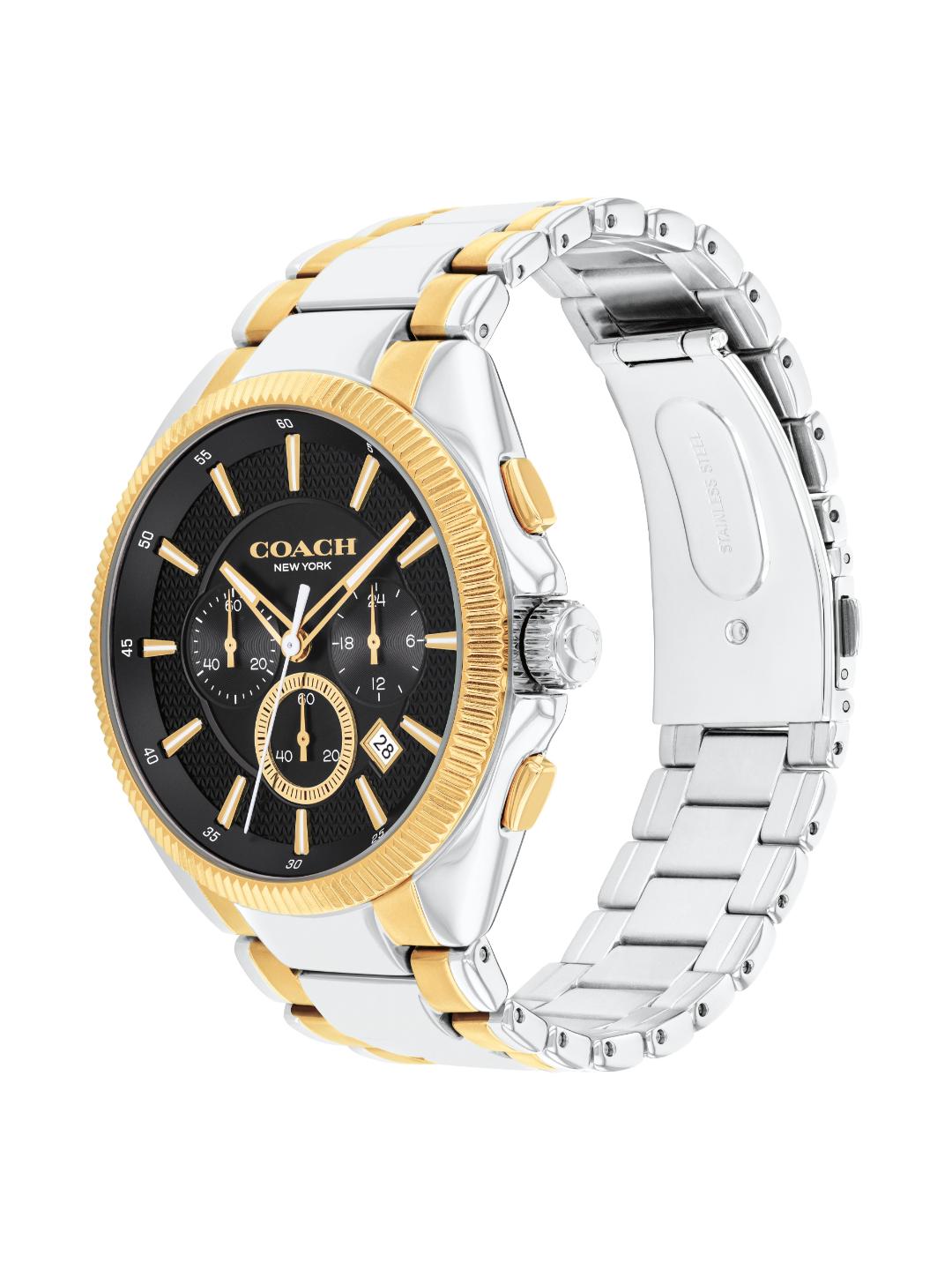 A Coach New York men's two-tone watch with a black dial, black bezel, and a silver and gold-tone stainless steel link bracelet, shown on a white background.