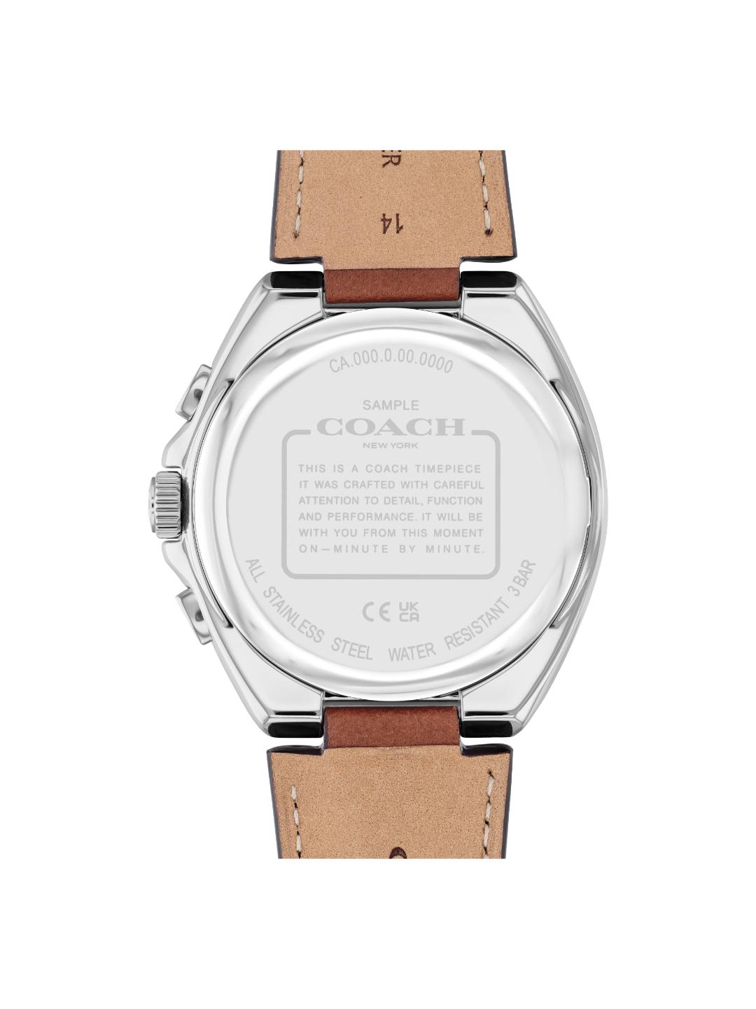 The back of a Coach wristwatch with a silver stainless steel case and a light brown leather strap, shown on a plain white background.