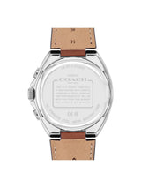 The back of a Coach wristwatch with a silver stainless steel case and a light brown leather strap, shown on a plain white background.