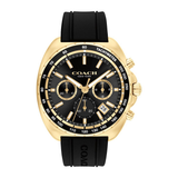 A Coach New York men's chronograph watch featuring a gold-tone case, black dial with gold accents, and a black rubber strap.