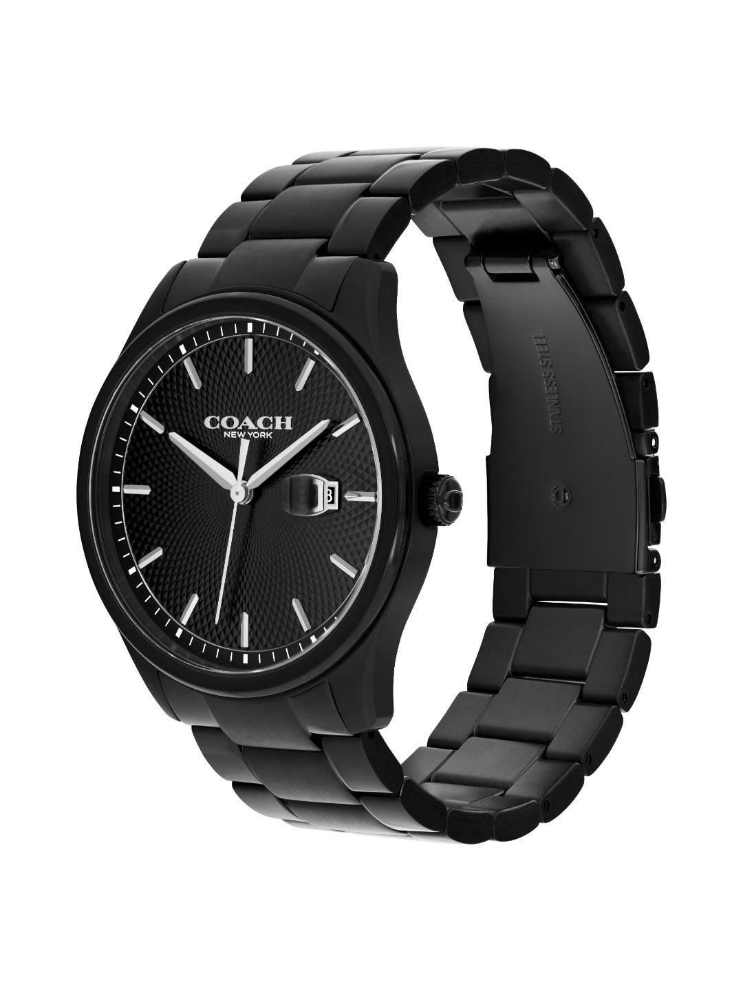 A Coach New York men's watch featuring a matte black stainless steel case and link bracelet, with a textured black dial, silver-tone indices, and a date window.