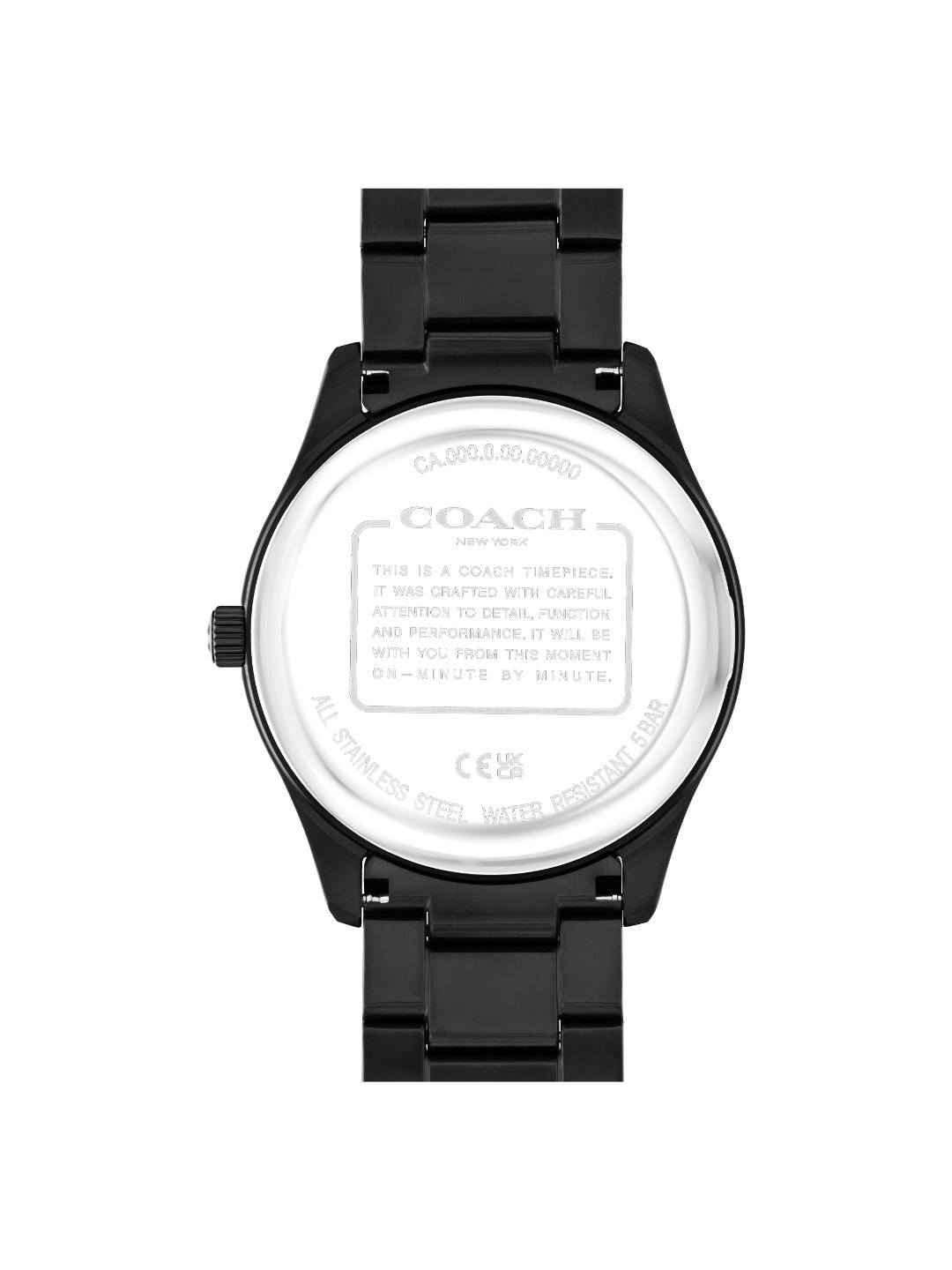 The back view of a Coach wristwatch with a black metal case and link bracelet, showing the brushed silver-toned back casing and engraved details.