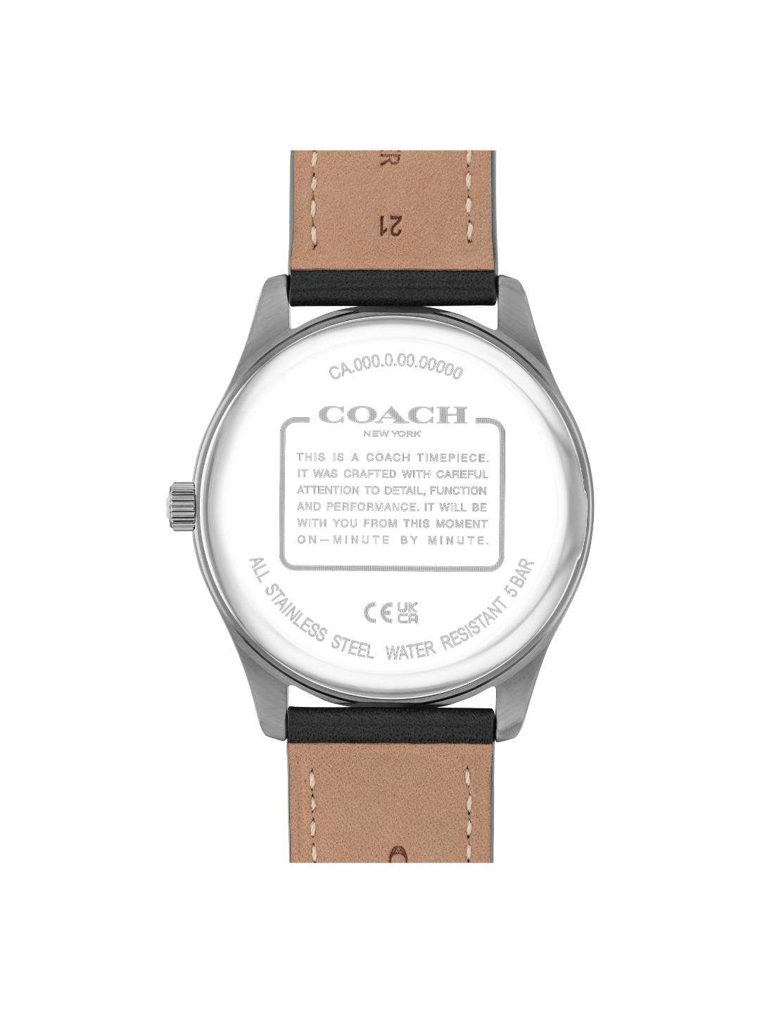 The back of a Coach wristwatch with a silver stainless steel case and a light brown leather strap, shown on a plain white background.
