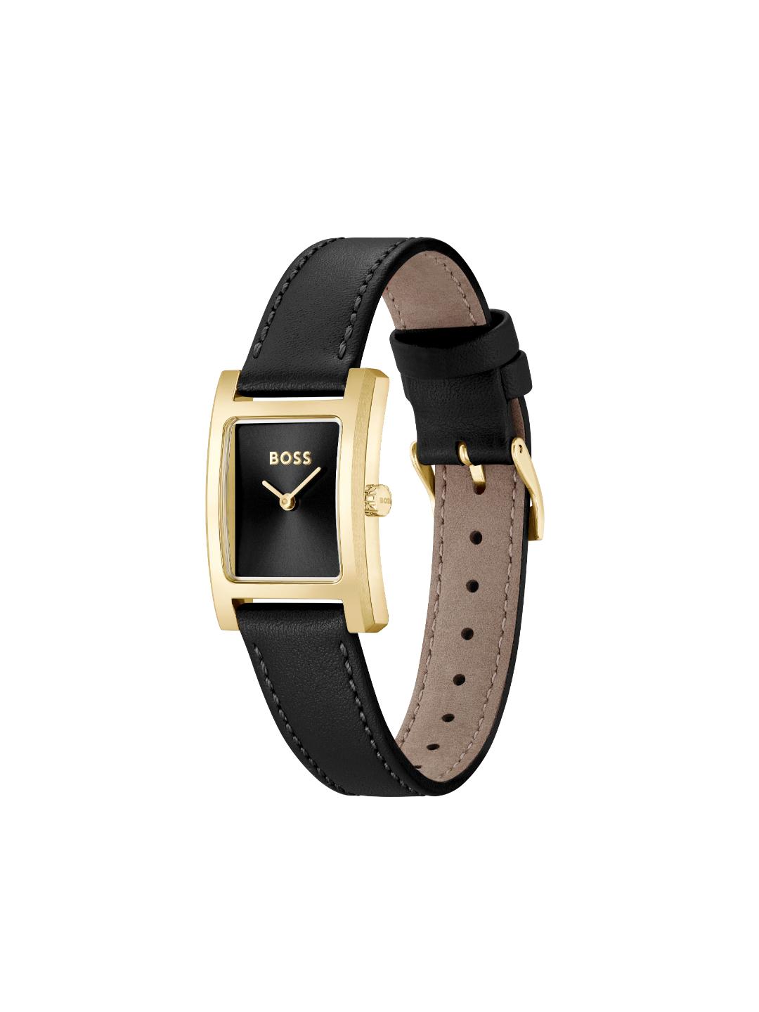 A BOSS women's watch featuring a rectangular gold-tone case, a black dial with gold hands, and a black leather strap with a tan interior, shown against a plain white background.
