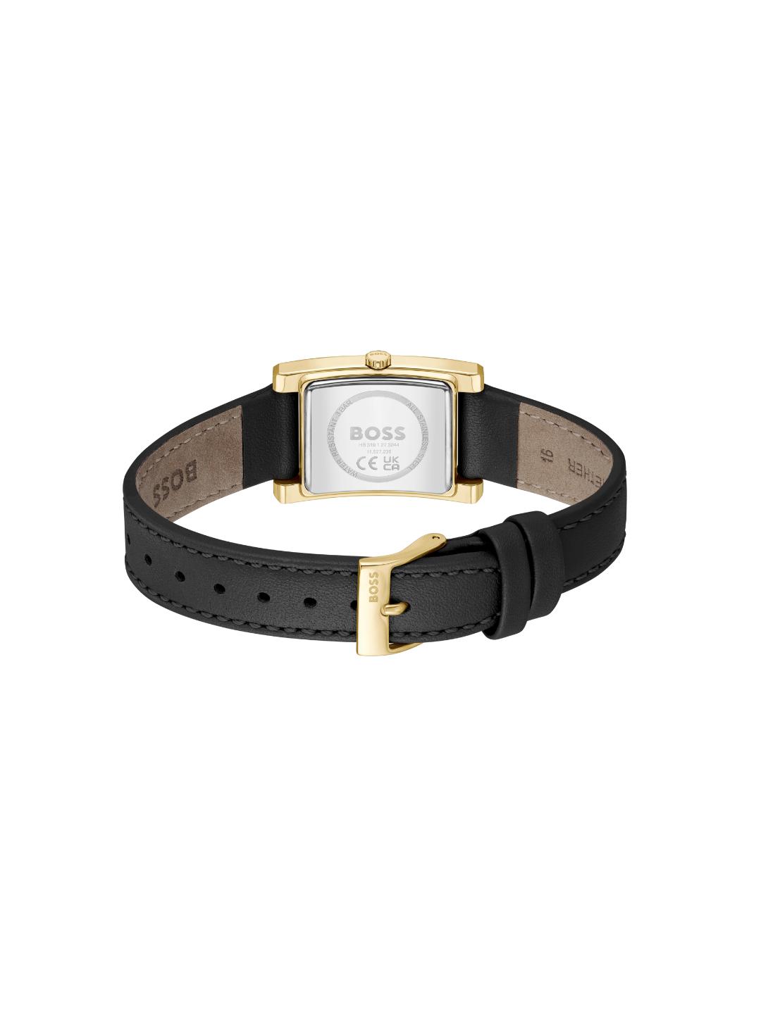 A BOSS women's watch with a black leather strap, gold-tone case, and silver-tone dial, shown from the back on a white background.
