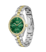 Two-tone watch with green dial and gold accents on a white background