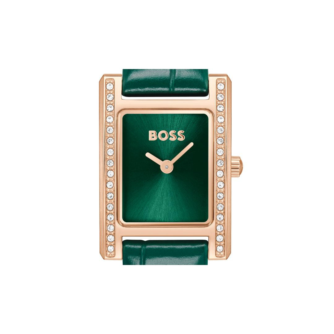 A rectangular BOSS watch with a green dial and green leather strap, framed in rose gold with a row of small clear stones on the sides.