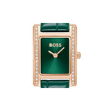 A rectangular BOSS watch with a green dial and green leather strap, framed in rose gold with a row of small clear stones on the sides.