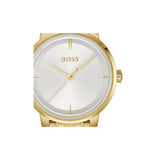 A Hugo Boss analog wristwatch with a gold-tone case and bracelet, featuring a white dial with gold-tone hands and hour markers.