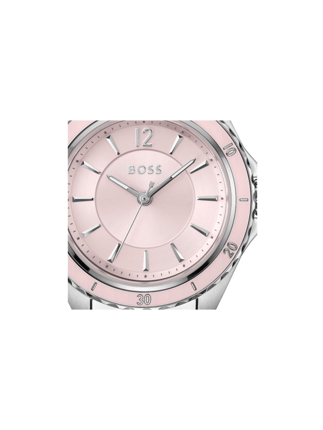 A close-up of a Hugo Boss watch with a light pink dial, silver-tone hands and markers, and a pink bezel, shown against a plain white background.