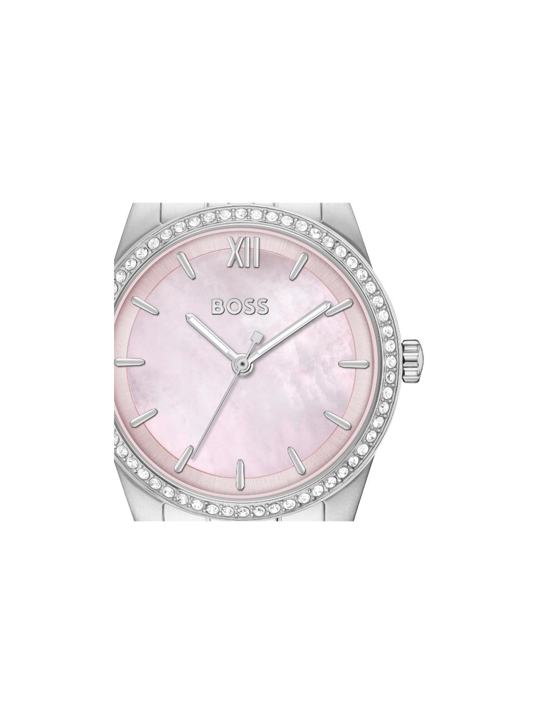 A BOSS women's watch featuring a round silver-tone stainless steel case, a bezel encrusted with clear rhinestones, and a pale pink mother-of-pearl dial with silver-tone hands and Roman numeral XII.