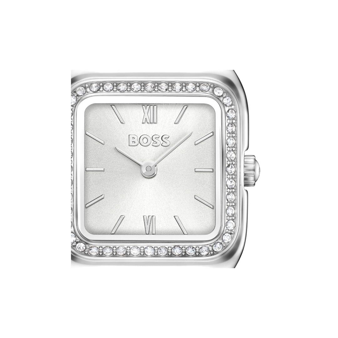 A silver BOSS watch with a square silver dial, Roman numeral hour markers, and a bezel encrusted with small clear stones, shown against a plain white background.