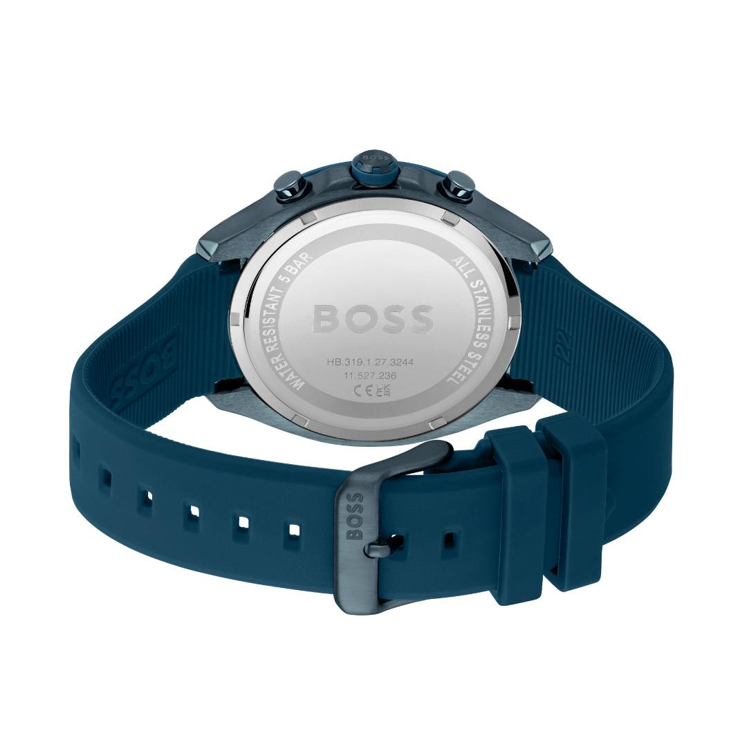 The back view of a Hugo Boss watch with a dark teal silicone strap and a silver-toned metal case back, shown on a plain white background.
