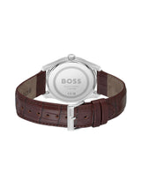 The back view of a HUGO BOSS watch with a brown leather strap and a silver stainless steel case, showing the engraved BOSS logo on the back.