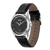 A Hugo Boss men's analog watch with a black textured dial, silver-tone case, and a black alligator-patterned leather strap with a tan interior, shown on a plain white background.