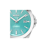 A close-up of a Hugo Boss watch with a turquoise dial, silver-tone case, and silver hour markers on a white background.