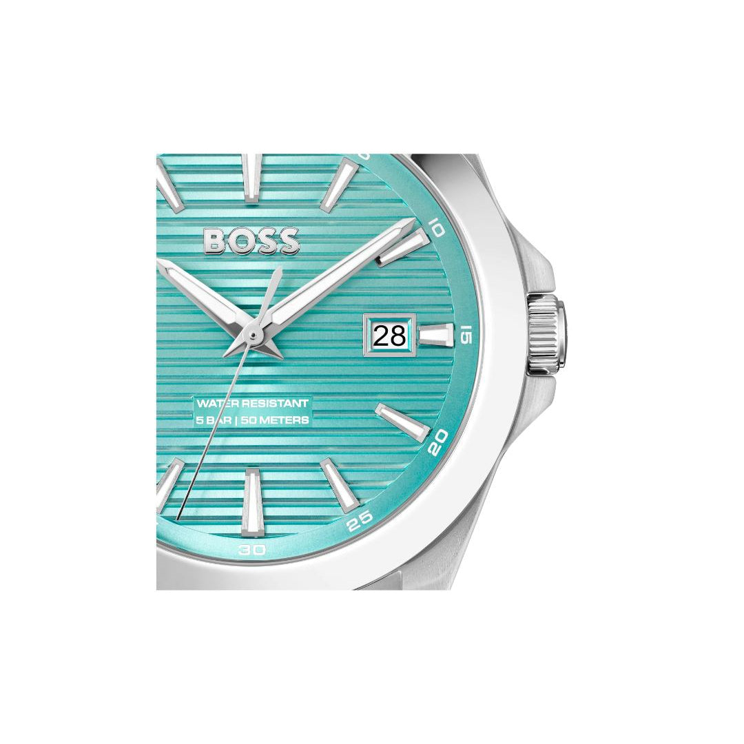 A close-up of a Hugo Boss watch with a turquoise dial, silver-tone case, and silver hour markers on a white background.