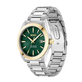 A Hugo Boss men's watch featuring a silver stainless steel link bracelet, a green dial, and gold-tone accents on the bezel, hands, and date window.