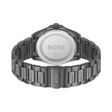 The back view of a BOSS watch with a dark gunmetal gray metal link bracelet and a matching dark gunmetal case, showing the brushed silver-toned case back engraved with the BOSS logo.