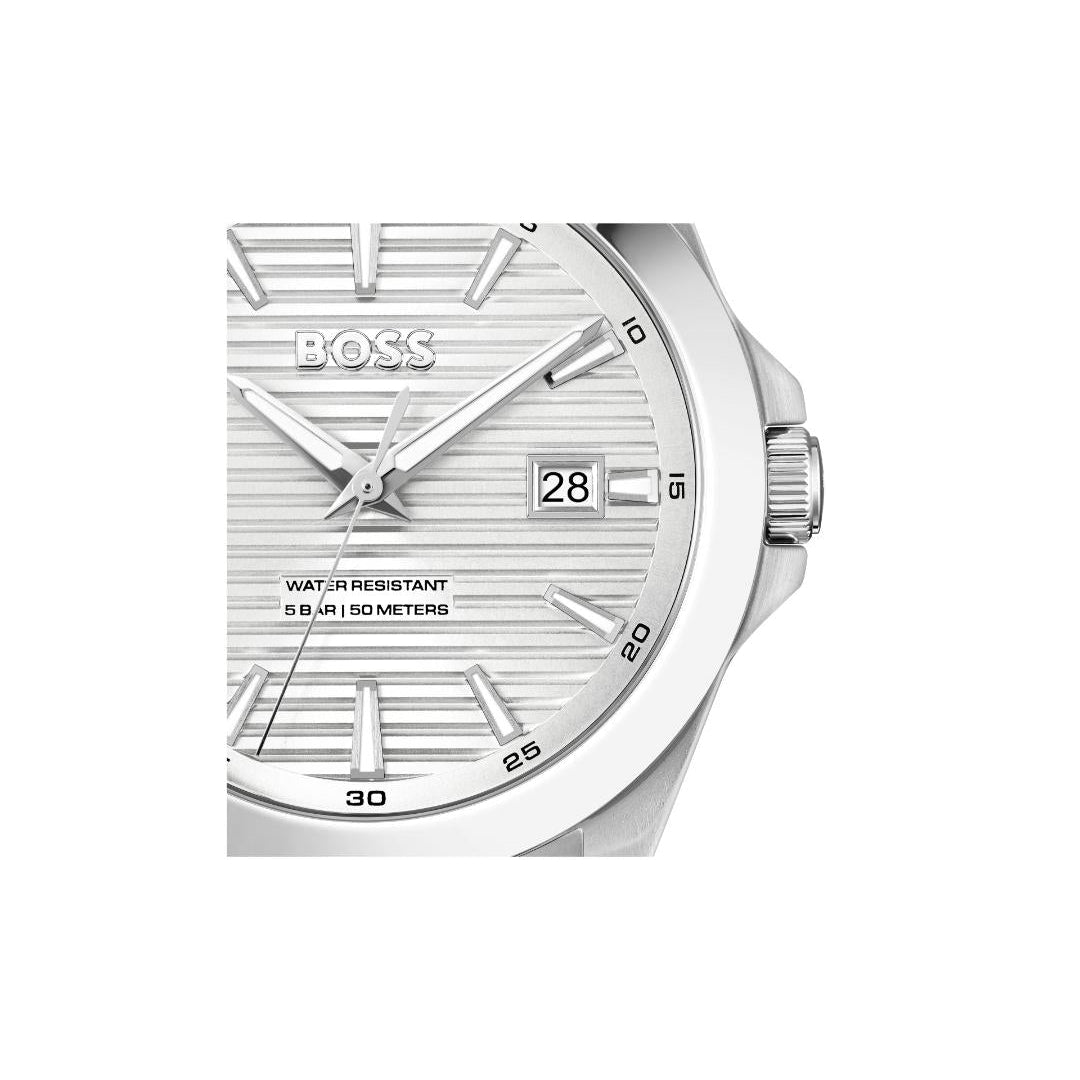 A close-up of a Hugo Boss wristwatch with a silver-tone stainless steel case and a textured silver dial, featuring a date window showing '28'.