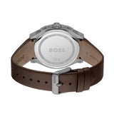 The back view of a BOSS watch with a brown leather strap and a silver stainless steel case, showing the engraved details on the dial.