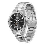 Silver watch with black dial on a white background