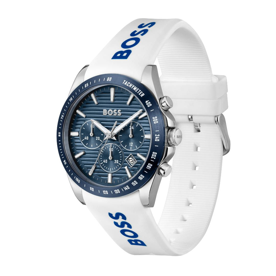 A Hugo Boss analog watch with a white textured silicone strap featuring blue 'BOSS' branding, a blue sunburst dial with three subdials, and a blue bezel.